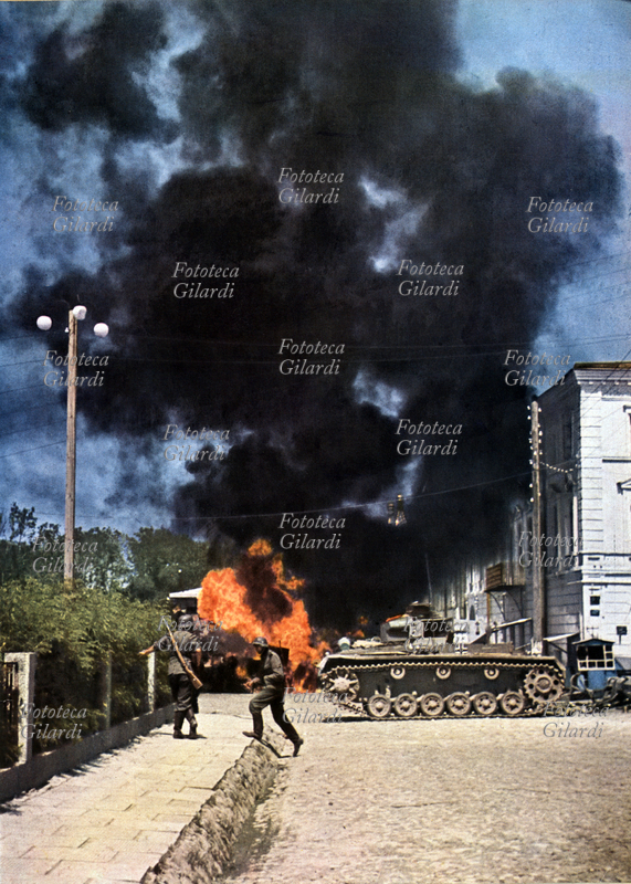 IIa GM Germany / USSR The German anti-tank artillery has fully hit a tank and ignited Soviet trucks. photographic image published in \