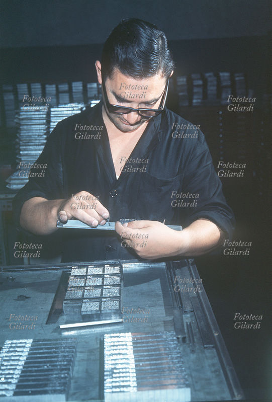 PRINT Composer printer aligns characters for a page title. The image is part of a large series on #work-in-typography which the photographer had always been passionate about over the years, in various locations. Photography by Ando Gilardi (1921 -2012) #andogilardi. Italy, circa 1955.