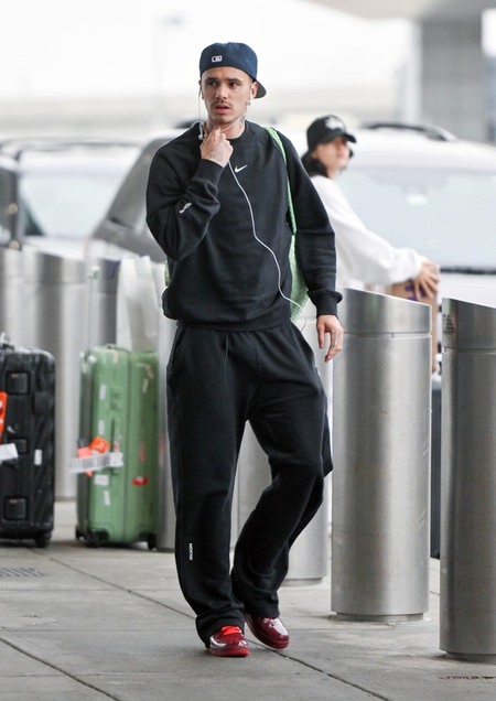 Romeo Beckham and Girlfriend Kim Turnbull Are Spotted at JFK Airport in New York City
