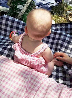 Elsie Hewitt celebrated seven months with daughter Scottie Rose in matching outfits during a park picnic