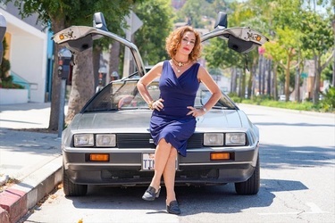 Claudia Wells Poses for Pictures Next to a Delorean