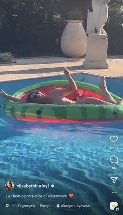 Liz Hurley poses totally nude on a slice of watermelon Liz Hurley poses totally nude on a slice of watermelon