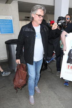 Goldie Hawn and Kurt Russell arrive at the airport