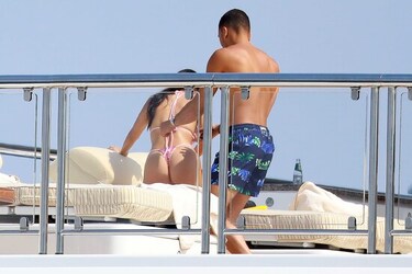 He certainly has some thong to smile about Side boob flashing Kourtney Kardashian s toyboy lover grins as she flaunts her behind in TINY bikini for another day frolicking on a yacht in Cannes