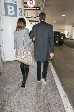 Milla Jovovich and husband director Paul W. S. Anderson were spotted returning to Los Angeles at LAX.