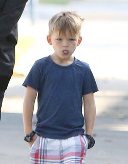 Jennifer Garner carries a school project as she takes her kids to school