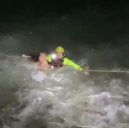 VIDEO Foolish man who went for night time swim in treacherous sea is saved by hero firefighters who dived in after him