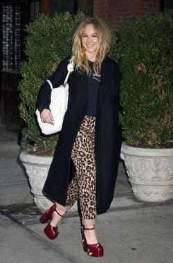 Juno Temple is pictured chatting on a cellphone outside her hotel in New York City.