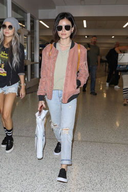 Pretty Little Liars star Lucy Hale looks cute in a rose colored silk bomber light green tee ripped jeans and black tennis shoes as she touches down in L.A. after a long flight from NYC. Pretty Little Liars star Lucy Hale looks cute in a rose colored silk bomber light green tee ripped jeans and black tennis shoes as she touches down in L.A. after a long flight from NYC.