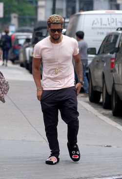 Usher wears comical slippers as he walks in Tribeca