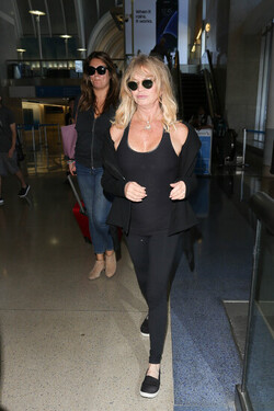 Goldie Hawn and Kurt Russell arrive at the airport
