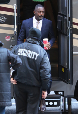 Idris Elba wears a Navy Blue Pinstriped Suit on set of Molly s Game in Toronto