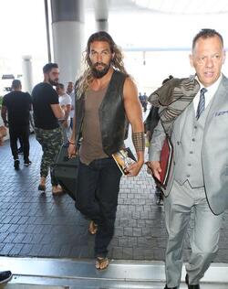 Jason Momoa Clutches His Favorite Pillow Going Through LAX TSA
