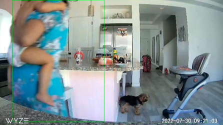 Inquisitive toddler nearly falls from highchair before super mum catches her Inquisitive toddler nearly falls from highchair before super mum catches her