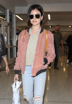 Pretty Little Liars star Lucy Hale looks cute in a rose colored silk bomber light green tee ripped jeans and black tennis shoes as she touches down in L.A. after a long flight from NYC. Pretty Little Liars star Lucy Hale looks cute in a rose colored silk bomber light green tee ripped jeans and black tennis shoes as she touches down in L.A. after a long flight from NYC.
