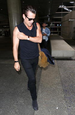 Colin Farrell was spotted in a sleeveless t shirt at LAX