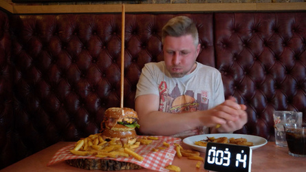 Foodie Smashes Record For Huge Burger Tower Challenge Foodie Smashes Record For Huge Burger Tower Challenge