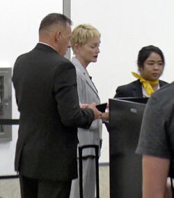 Sharon Stone Shows New Pixie Do Sports Pinstripe Suit At LAX Sharon Stone Shows New Pixie Do Sports Pinstripe Suit At LAX