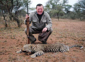 Pic shows comedian Cesar Cadaval 

A popular Spanish comedian has caused outrage by posing For a photo alongside a dead leopard he had hunted during a safari 

Cesar Cadaval who is famous for his duo act called Los Morancos has become the centre of