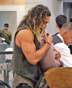 Jason Momoa Clutches His Favorite Pillow Going Through LAX TSA