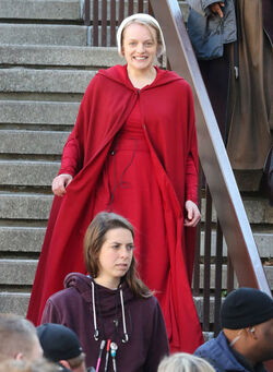 EXCLUSIVE Elisabeth Moss in Costume as Offred in The Handmaid s Tale Filming in Toronto.