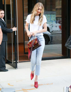 Gigi Hadid leaves her apartment in a plain white tee and red heels Gigi Hadid leaves her apartment in a plain white tee and red heels