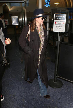 Diane Lane wears a coy smile at LAX after recently admitting on Watch What Happens Live with Andy Cohen that she once had a fling with rocker Bon Jovi back in the 80s. Diane Lane wears a coy smile at LAX after recently admitting on Watch What Happens Live with Andy Cohen that she once had a fling with rocker Bon Jovi back in the 80s.
