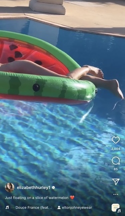 Liz Hurley poses totally nude on a slice of watermelon Liz Hurley poses totally nude on a slice of watermelon