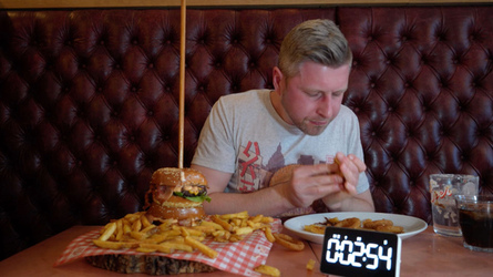 Foodie Smashes Record For Huge Burger Tower Challenge Foodie Smashes Record For Huge Burger Tower Challenge