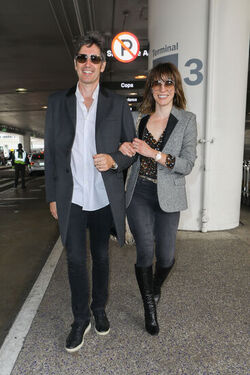 Milla Jovovich and husband director Paul W. S. Anderson were spotted returning to Los Angeles at LAX.