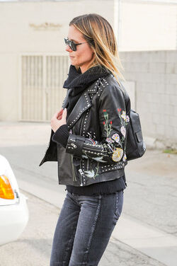 Heidi Klum rocks studded leather jacket with flower motif