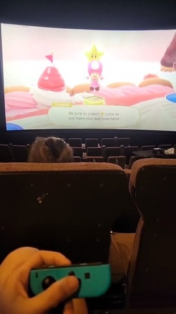 Woman goes viral renting entire CINEMA screen to play video games with mates Woman goes viral renting entire CINEMA screen to play video games with mates