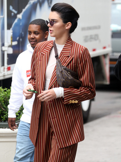 Kendall Jenner Accessorizes a Striped Suit with a Louis Vuitton Fanny Pack Kendall Jenner Accessorizes a Striped Suit with a Louis Vuitton Fanny Pack