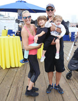 Molly Sims rides a stationary bike for charity