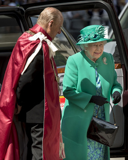 Queen Elizabeth II and Prince Philip Duke of Edinburgh attend a service to mark the 100th anniversary of the Order of the British Empire at St Paul s Cathedral in London.