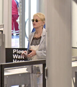 Sharon Stone Shows New Pixie Do Sports Pinstripe Suit At LAX Sharon Stone Shows New Pixie Do Sports Pinstripe Suit At LAX