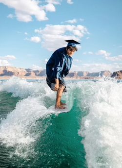 HIGH SCHOOL GRADUATE TAKES UNIQUE GRADUATION PHOTOS WHILE WAKESURFING