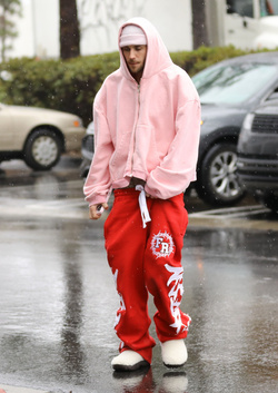 Disheveled Justin Bieber goes go karting in the rain