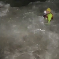 VIDEO Foolish man who went for night time swim in treacherous sea is saved by hero firefighters who dived in after him