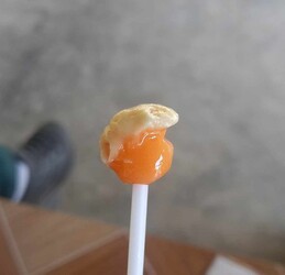 HILARIOUS IMAGES show a lollipop that has been sucked into the shape of Donald Trump.