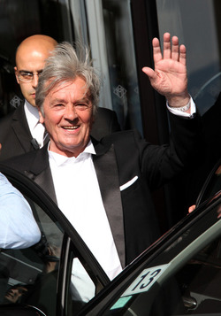 Alain Delon leaves his hotel in Cannes