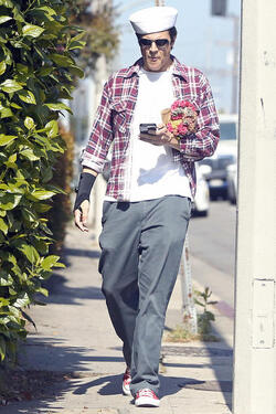 Johnny Knoxville Accesorizes with Sailor Hat and Wrist Brace