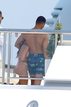He certainly has some thong to smile about Side boob flashing Kourtney Kardashian s toyboy lover grins as she flaunts her behind in TINY bikini for another day frolicking on a yacht in Cannes