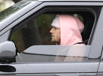 Disheveled Justin Bieber goes go karting in the rain