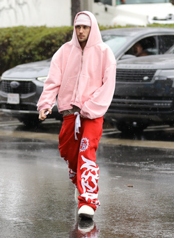 Disheveled Justin Bieber goes go karting in the rain