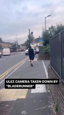 VIDEO Disgruntled masked man hacks down London ULEZ camera in broad daylight 48 hours after it was installed