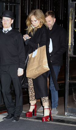 Juno Temple is pictured chatting on a cellphone outside her hotel in New York City.