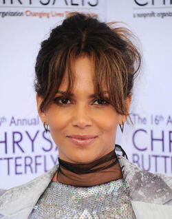 Pregnant at 50 Halle Berry cradles apparent baby bump at the Butterfly Ball