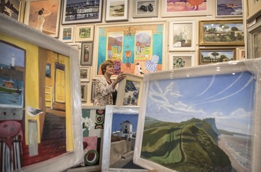 Sophie Miller of the Llewellyn Alexander gallery in Waterloo sifts through the approximately 600 works of art that has been rejected from the annual prestigious Royal Academy exhibition Sophie Miller of the Llewellyn Alexander gallery in Waterloo sifts through the approximately 600 works of art that has been rejected from the annual prestigious Royal Academy exhibition