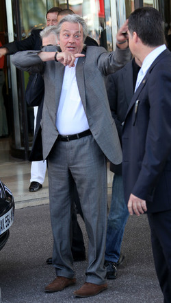 Alain Delon leaves his hotel in Cannes